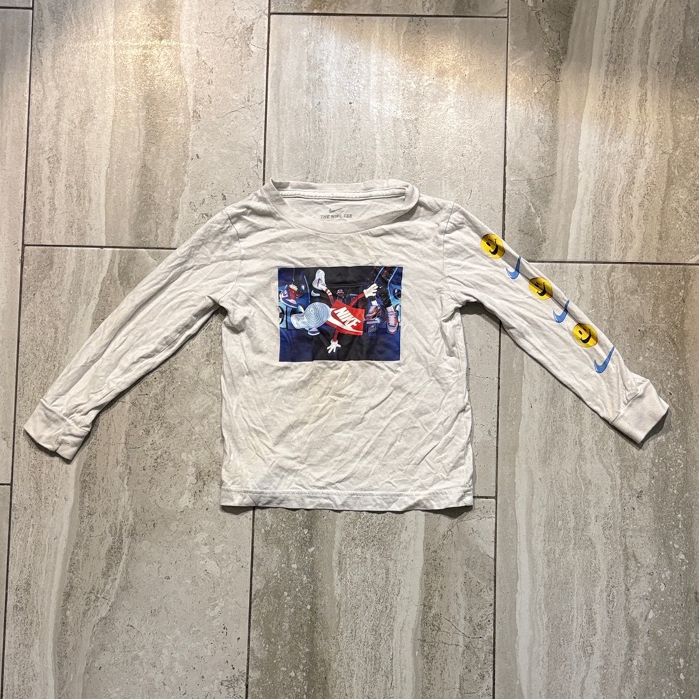 Nike Kids White Long-Sleeve Graphic Tee with Blue & Yellow Sleeve Icons